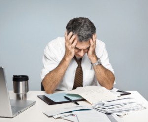 Frustrated Man Worries About Economy, Unpaid Bills and Retiremen